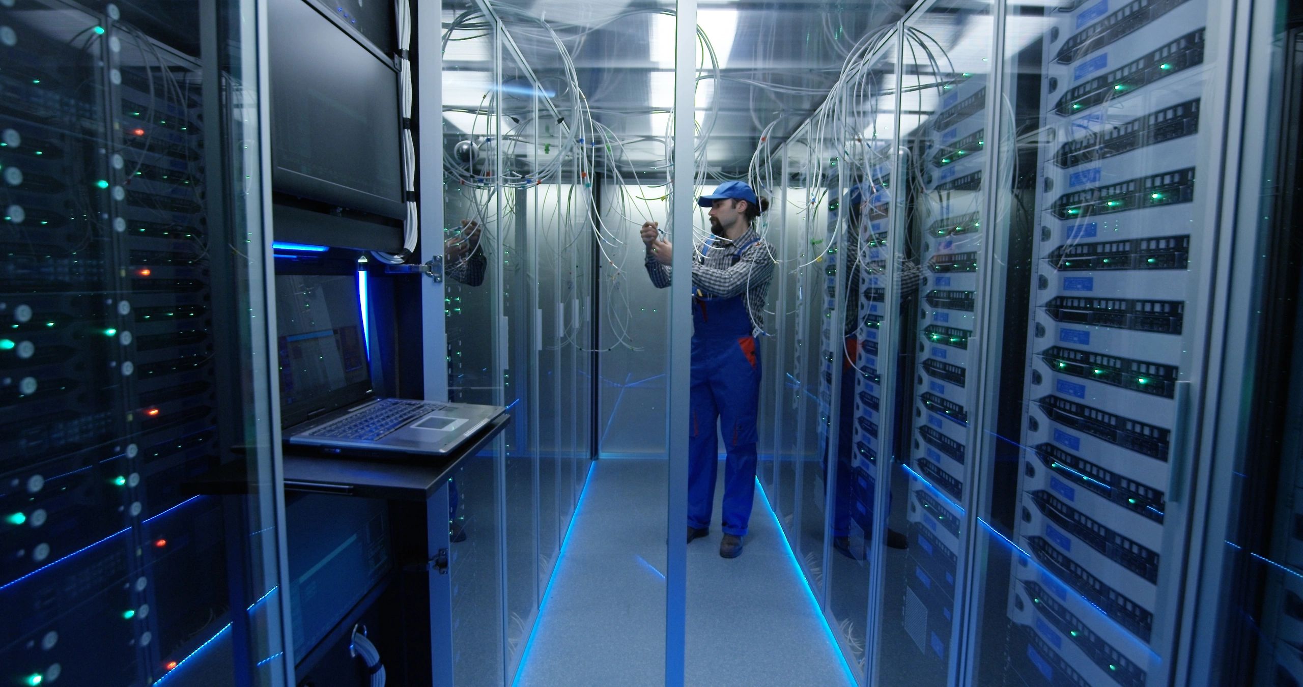 Technician supporting power backup and stabilizer equipment